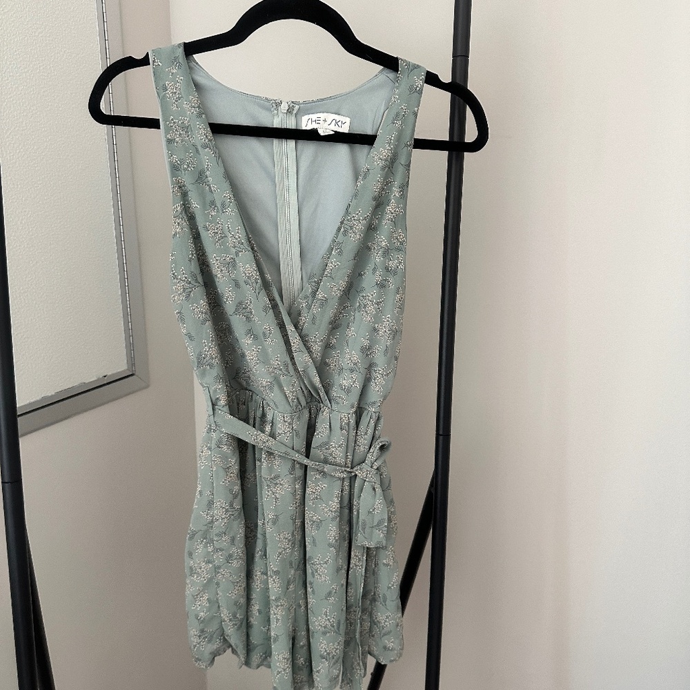 SHE + SKY Sage Green Floral Romper – Sleeveless Wrap Front, Belted Waist, Femini